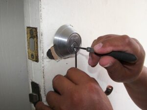 Emergency locksmith service removing a broken key from a house door lock in Harare.